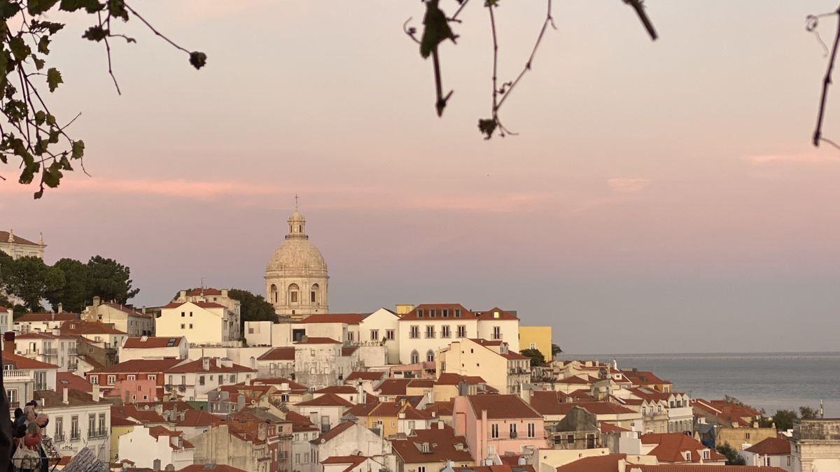The Alfama rooftops and the Pantheon dome at dusk, Lisbon