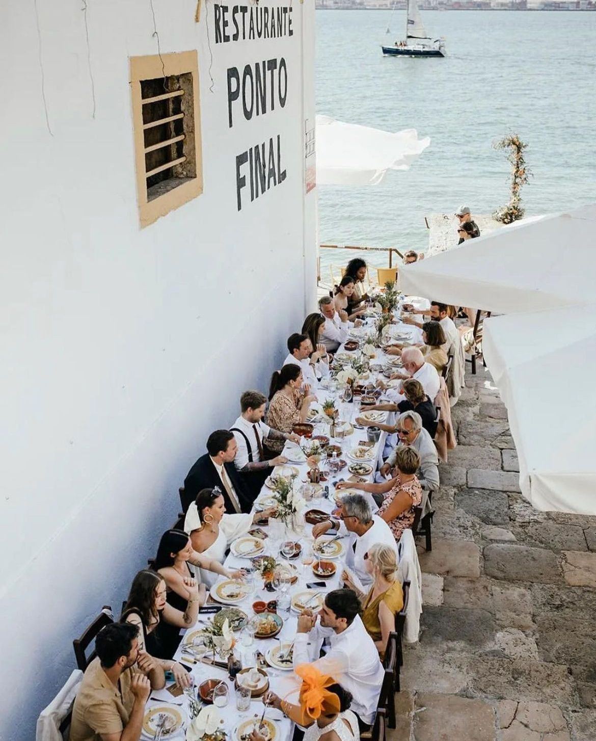 A long table by the Tagus at Ponto Final