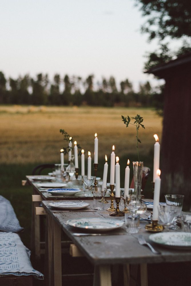 Candlelit table set in a field